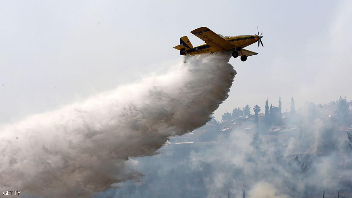 اندلعت الحرائق في إسرائيل من شمالها إلى جنوبها (Photo credit should read AHMAD GHARABLI/AFP/Getty Images)